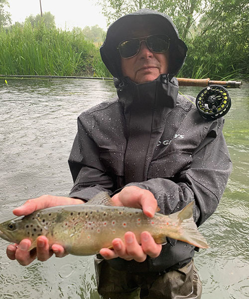 Man with fish on River Coln